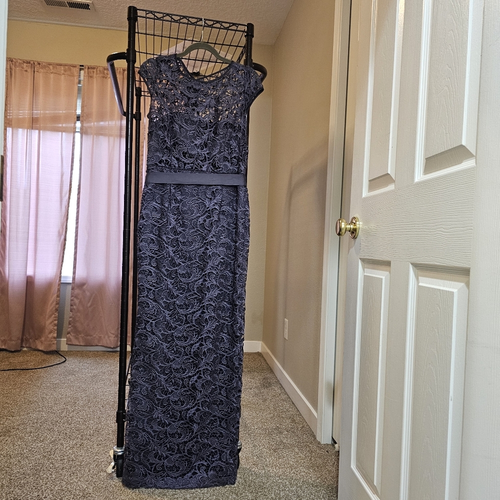 Adrianna Papell new with tags. Never worn.Grey/lavendar undertone.